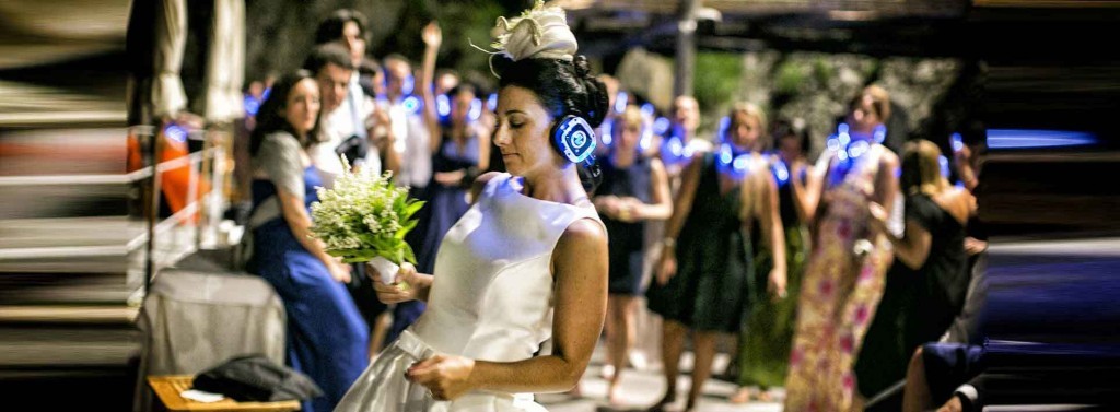 Bride dancing with light-up silent disco headphones